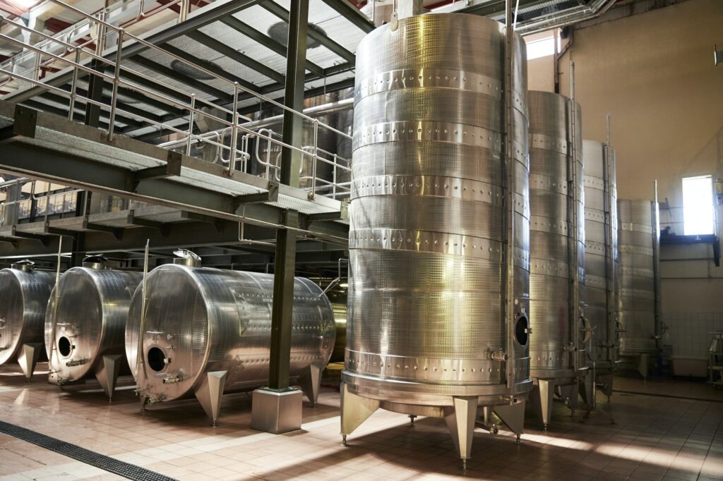 Metal winemaking equipment in a modern winemaking facility